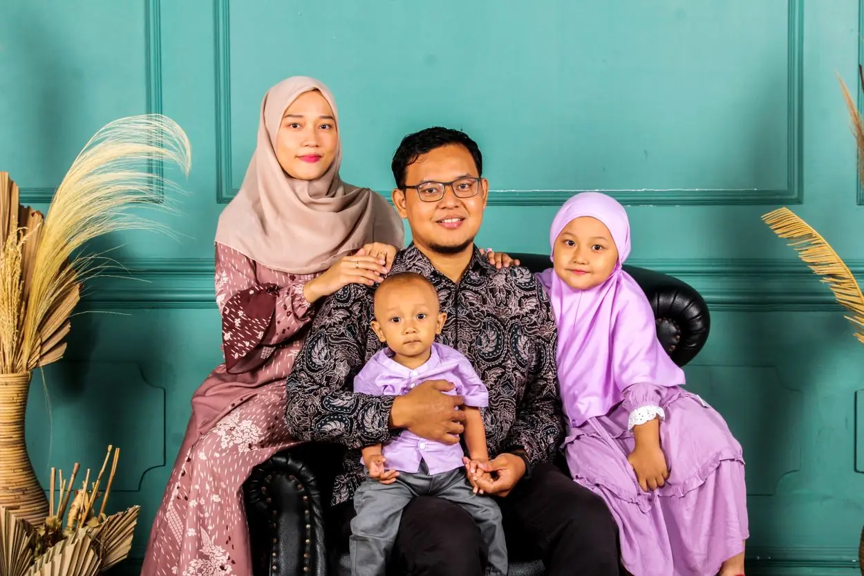 Illustrative lifestyle portrait of a Muslim family at home